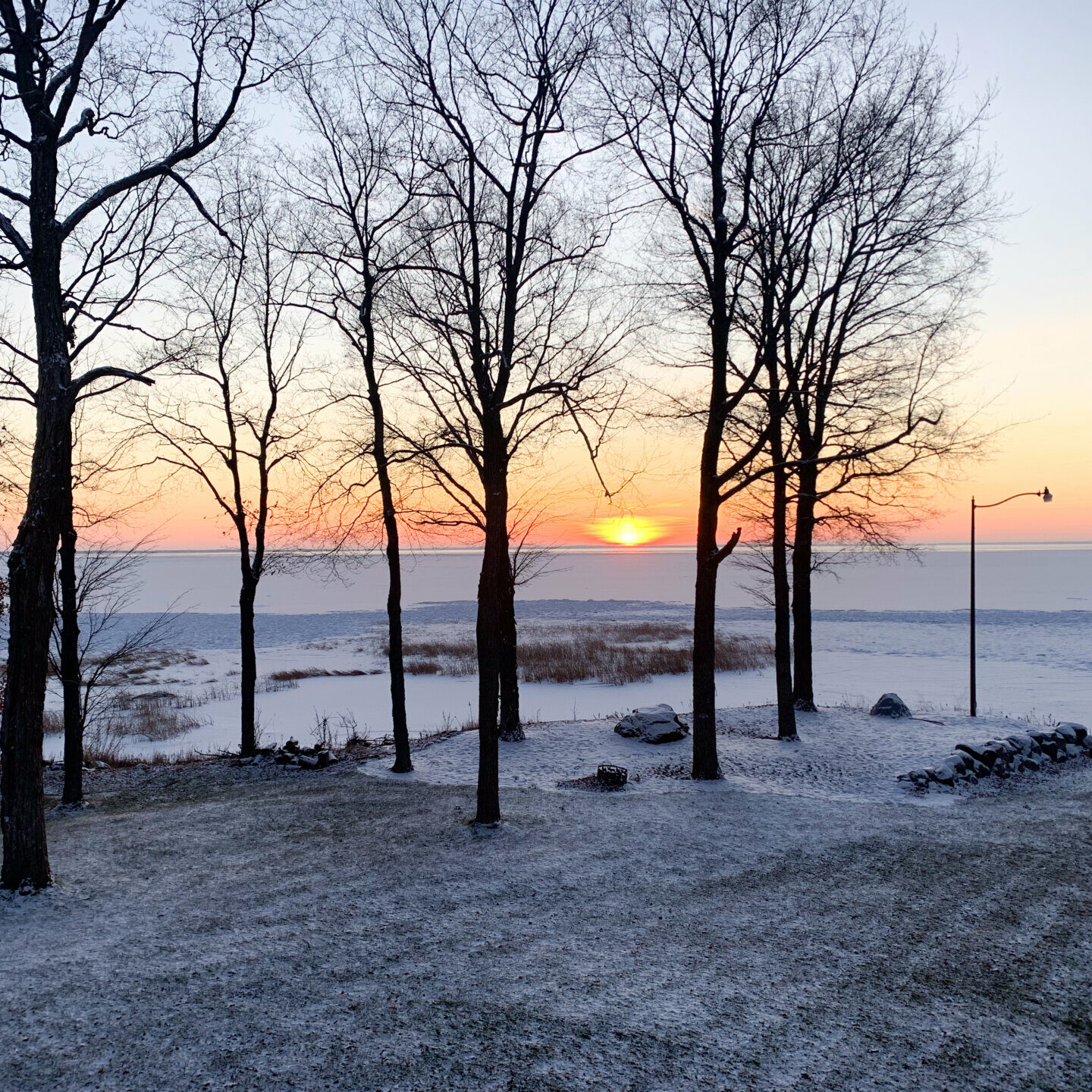 View of lake at sunset in winter